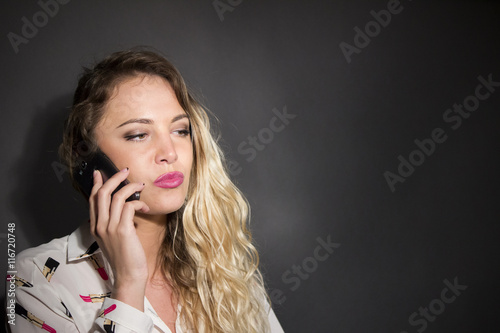 beautiful woman speak at telephone