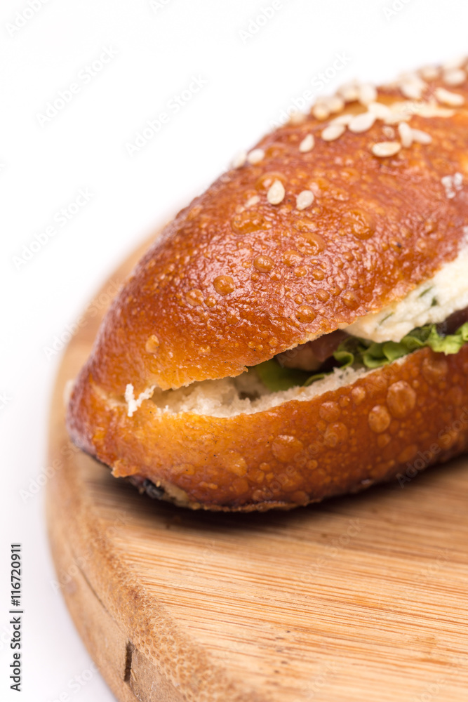 Sandwich roll with ham tomato and lettuce. Sandwich roll with ham tomato and lettuce.