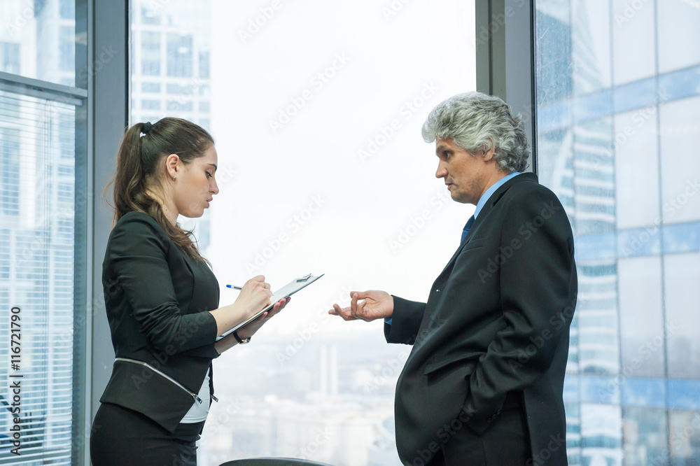 Boss instructs young secretary