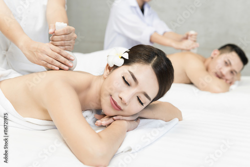 Picture of couple in spa salon getting massage