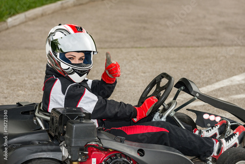 Go karting champion thumbs up, getting ready to race