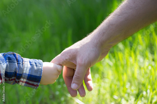 Hands of father and son © Volodymyr