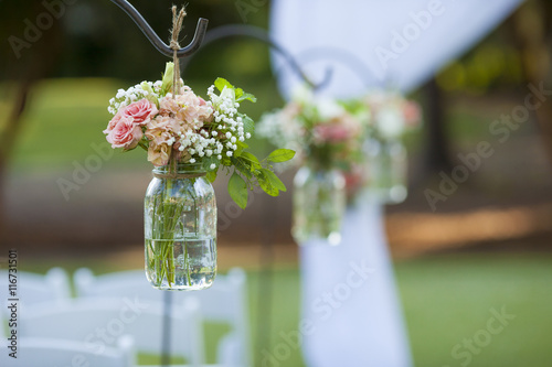 Fotografie Flowers and mason jar at wedding