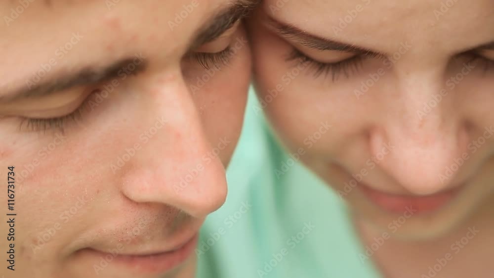 Love couple cheek to cheek. Close-up. Gentle movement Love couple cheek to cheek. Close-up. Gentle movement
