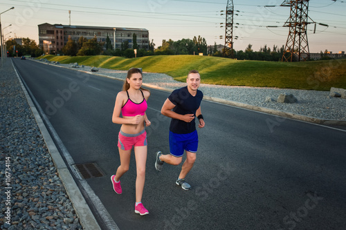 Full length portrait of athletic couple running