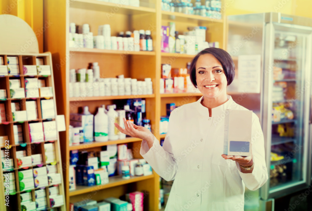 Woman in white coat promoting food additive goods in carton in d