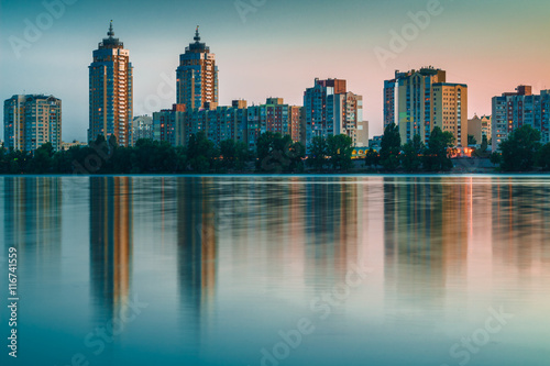 Night city reflected in river waters