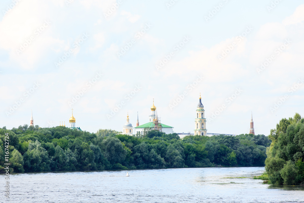 The Orthodox Church stands on the banks of the river, summer, tr The Orthodox Church stands on the banks of the river, summer, tr