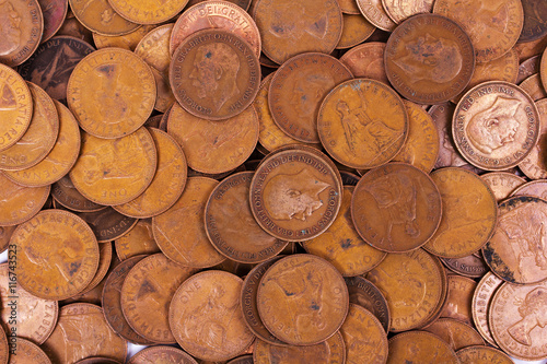 Old penny coins spread out for background