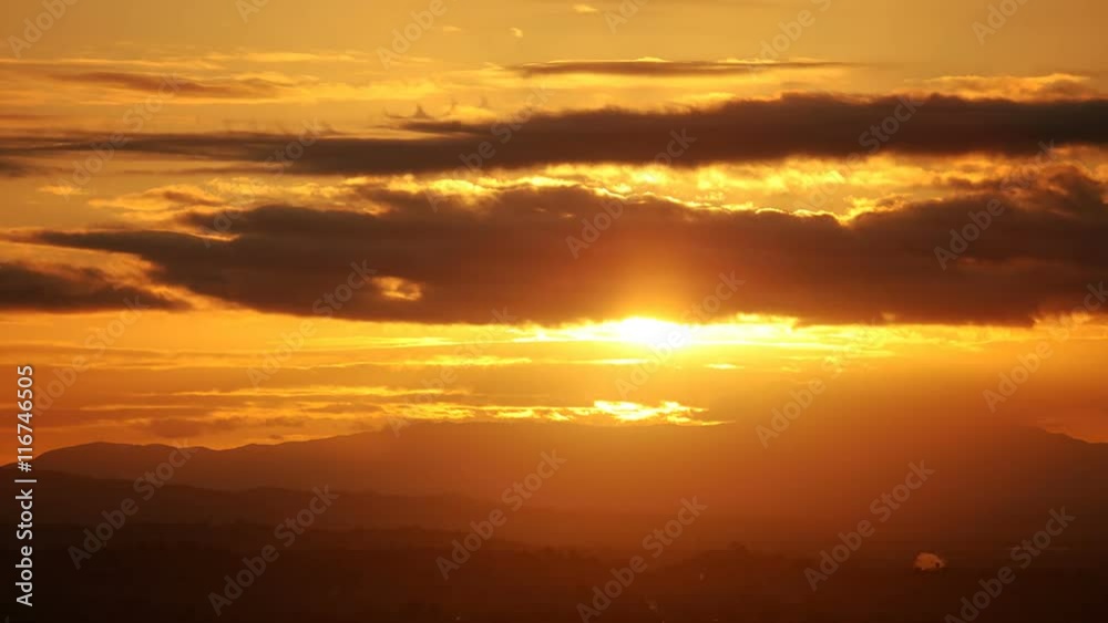 Time Lapse of the sun rising behind clouds. Time Lapse of the sun rising behind clouds.
