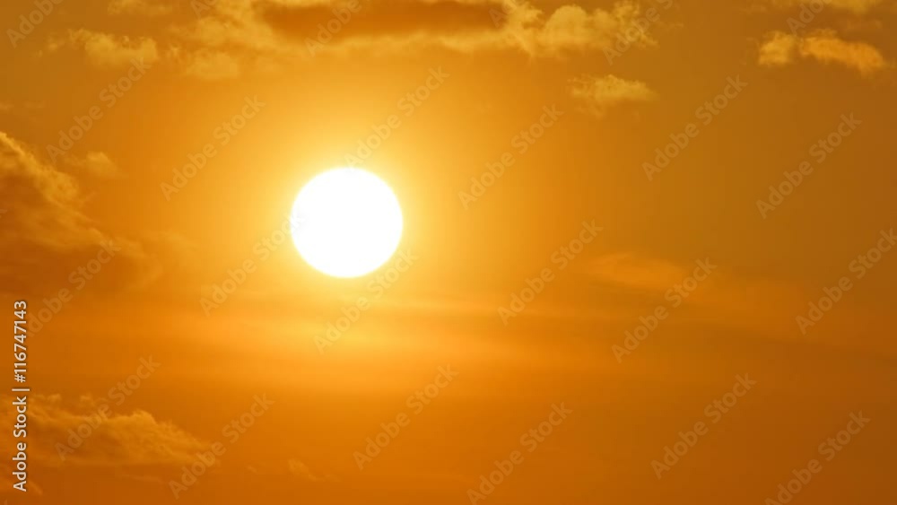 Beautiful time lapse of the sun setting behind the clouds. Beautiful time lapse of the sun setting behind the clouds.