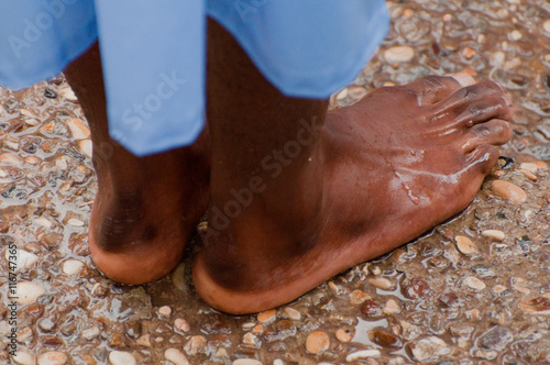 Fototapeta Yardenit, Israel - 29 Decembre 2012: wet feet of a man after his baptism in the Jordan River