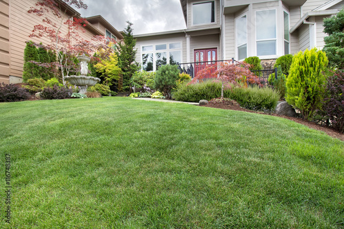 Green Grass Lawn in Manicured Frontyard Garden © jpldesigns