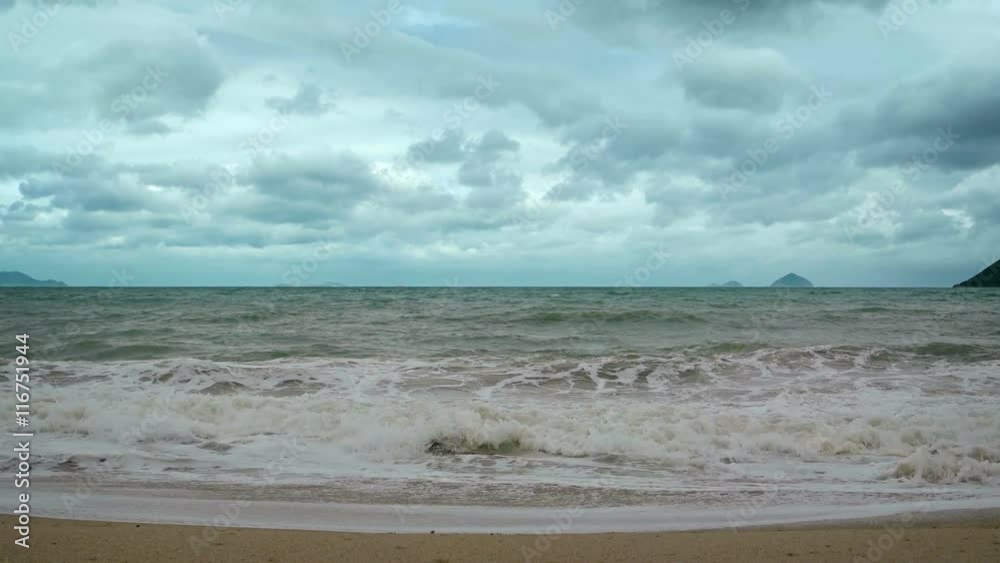 Small, gentle waves with sea foam wash over the coarse sand of a pristine beach wilderness on a cloudy day. Footage UHD Small, gentle waves with sea foam wash over the coarse sand of a pristine beach wilderness on a cloudy day. Footage UHD