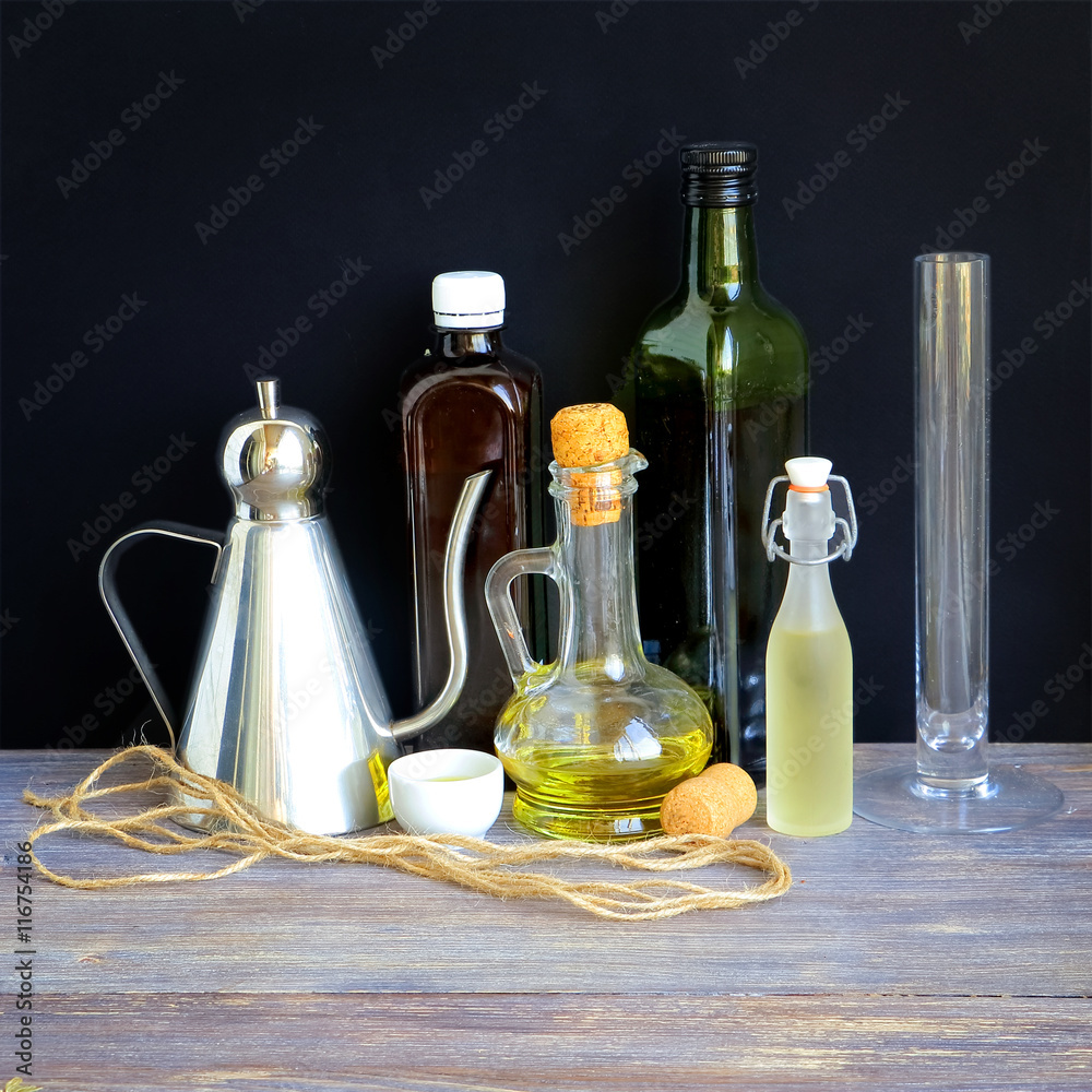 Random collection of kitchen bottles with oil, vinegar, wine etc. used for cooking and dressing
Random collection of kitchen bottles with oil, vinegar, wine etc. used for cooking and dressing