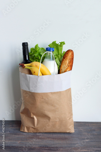 Big brown bag full of food products. Concept of healthy eating and eco friendly packing.