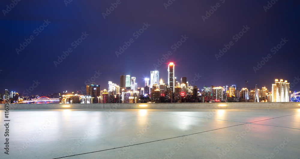 cityscape and skyline of chongqing at night from empty floor
