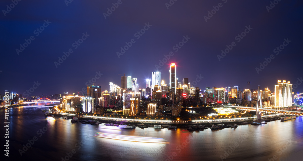 cityscape and skyline of downtown near water of chongqing night