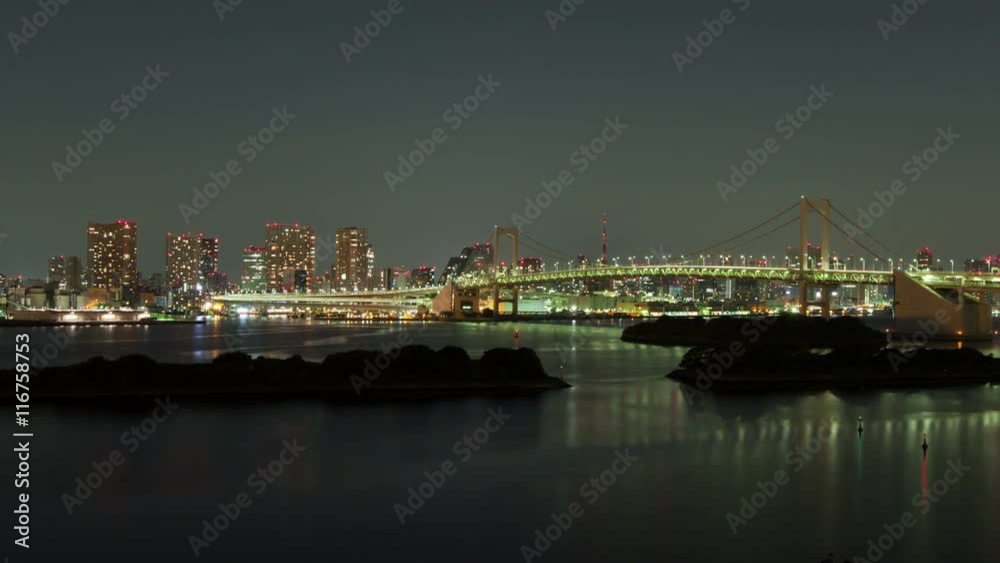 Night time-lapse of Tokyo Japan. You can see the Tokyo Harbor and rainbow bridge with the buildings of Tokyo in the background. Night time-lapse of Tokyo Japan. You can see the Tokyo Harbor and rainbow bridge with the buildings of Tokyo in the background.