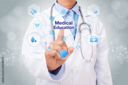 Doctor hand touching medical education sign on virtual screen. medical concept