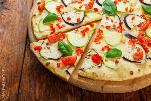Delicious vegetarian pizza with aubergines and zucchini