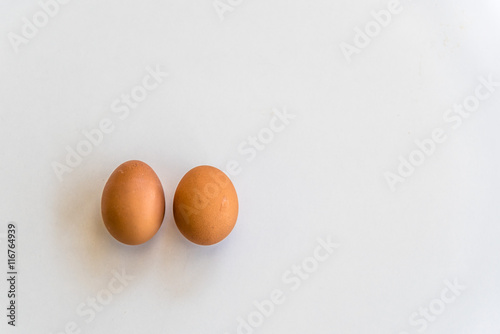 Top view of two eggs and isolated on white background with copy space
