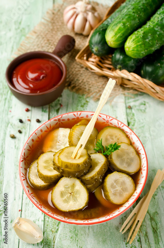 Spicy cucumbers with garlic in tomato marinade