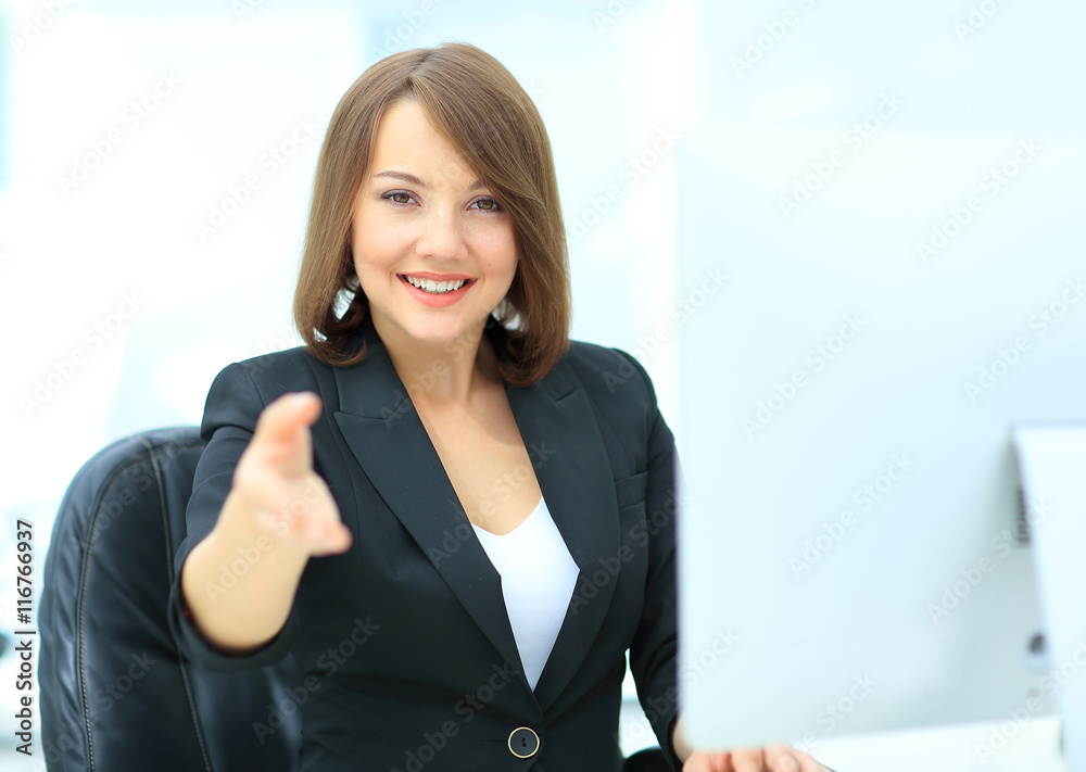 Happy smiling businesswoman in suit giving hand for handshake. Happy smiling businesswoman in suit giving hand for handshake.
