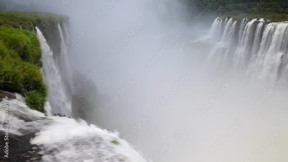 The beautiful and scenic Iguazu Falls on the border of Argentina and Brazil. The beautiful and scenic Iguazu Falls on the border of Argentina and Brazil.
