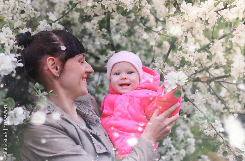 mom with baby in apple garden mom with baby in apple garden