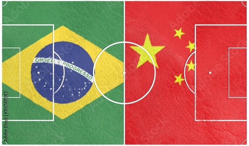 Flags of countries participating to the football tournament. Football field textured by China and Brazil national flags.3D rendering