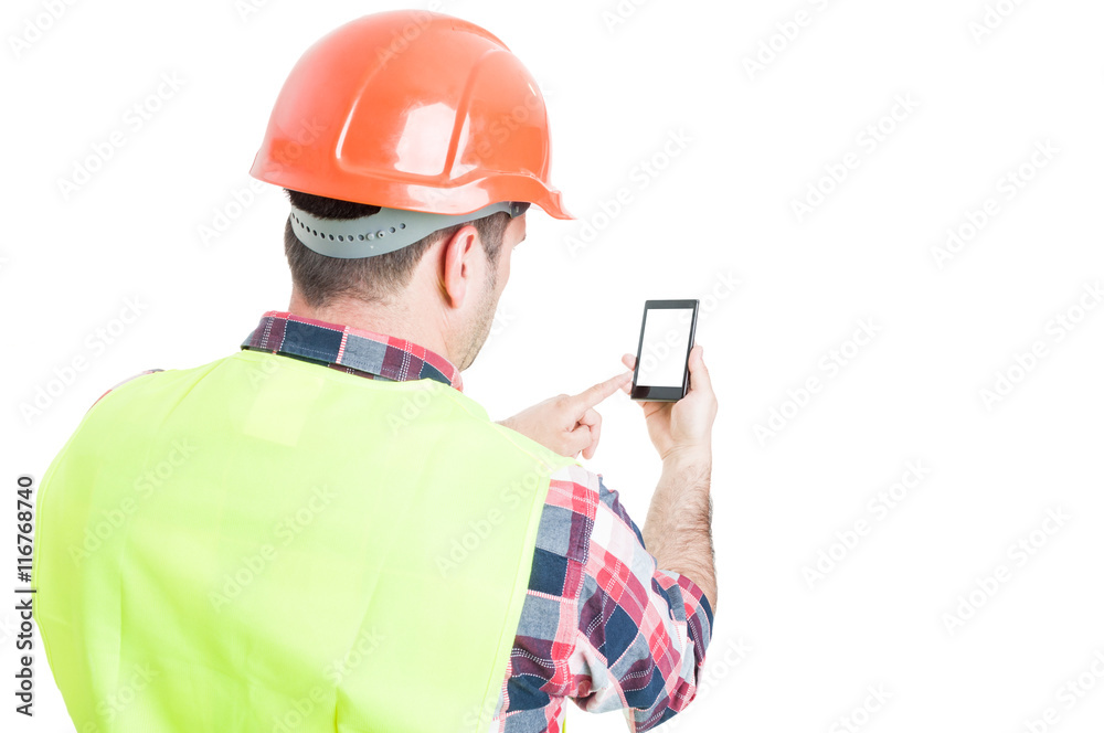 Backview of male engineer holding mobile phone Backview of male engineer holding mobile phone