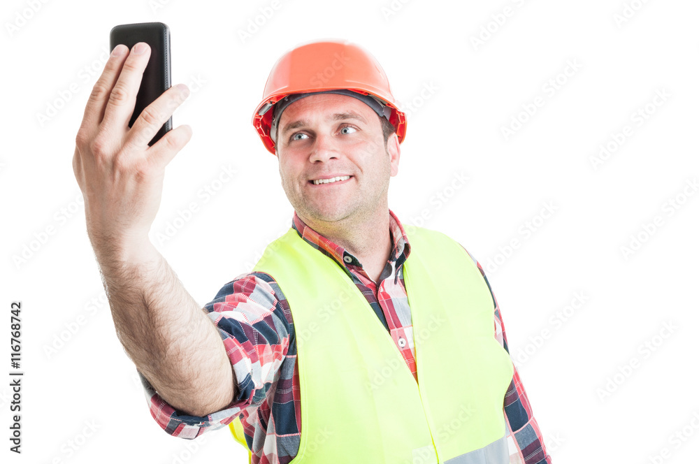 Smiling handsome builder making self portrait Smiling handsome builder making self portrait