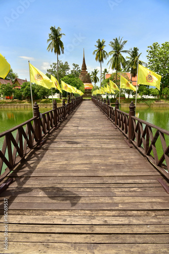 Wooden bridge to ruin pagoda cross river in Sukhothai © amornchai