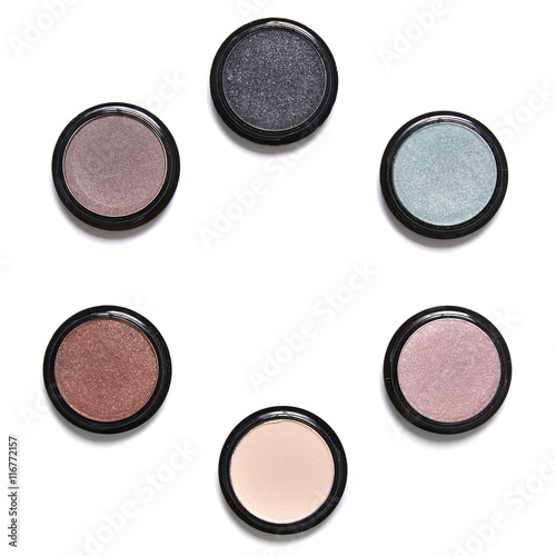 Fényképezés Individual eyeshadow make up pots arranged in a circle and isolated on a white b