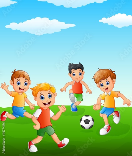 Happy kid playing soccer on the field