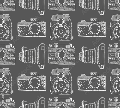 Seamless pattern background with hand drawn ornamental retro cameras. Vector illustration.