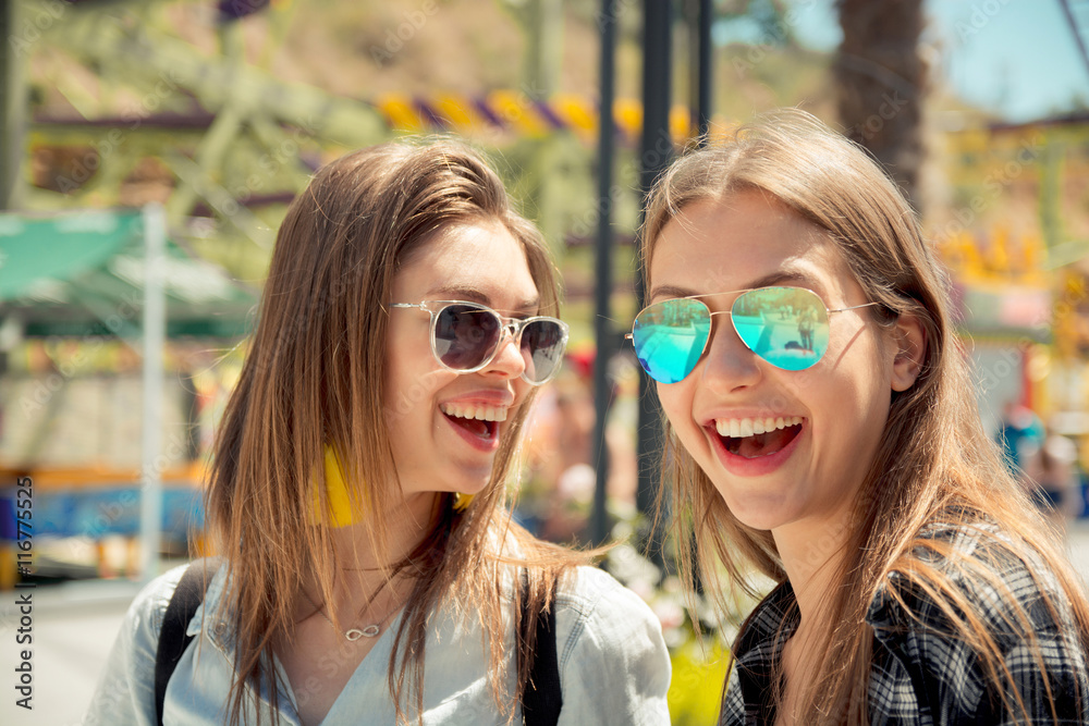 Lifestyle of two best friends laughing outdoor on the street Lifestyle of two best friends laughing outdoor on the street