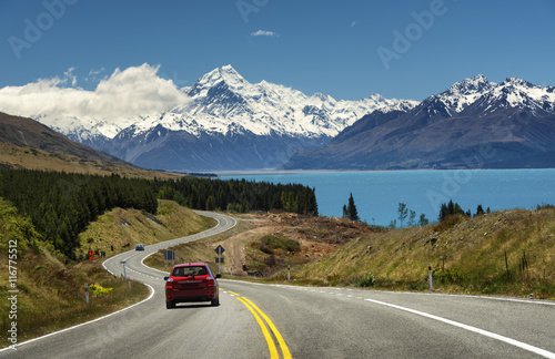Red car on the road to Mt.Cook,New Zealand