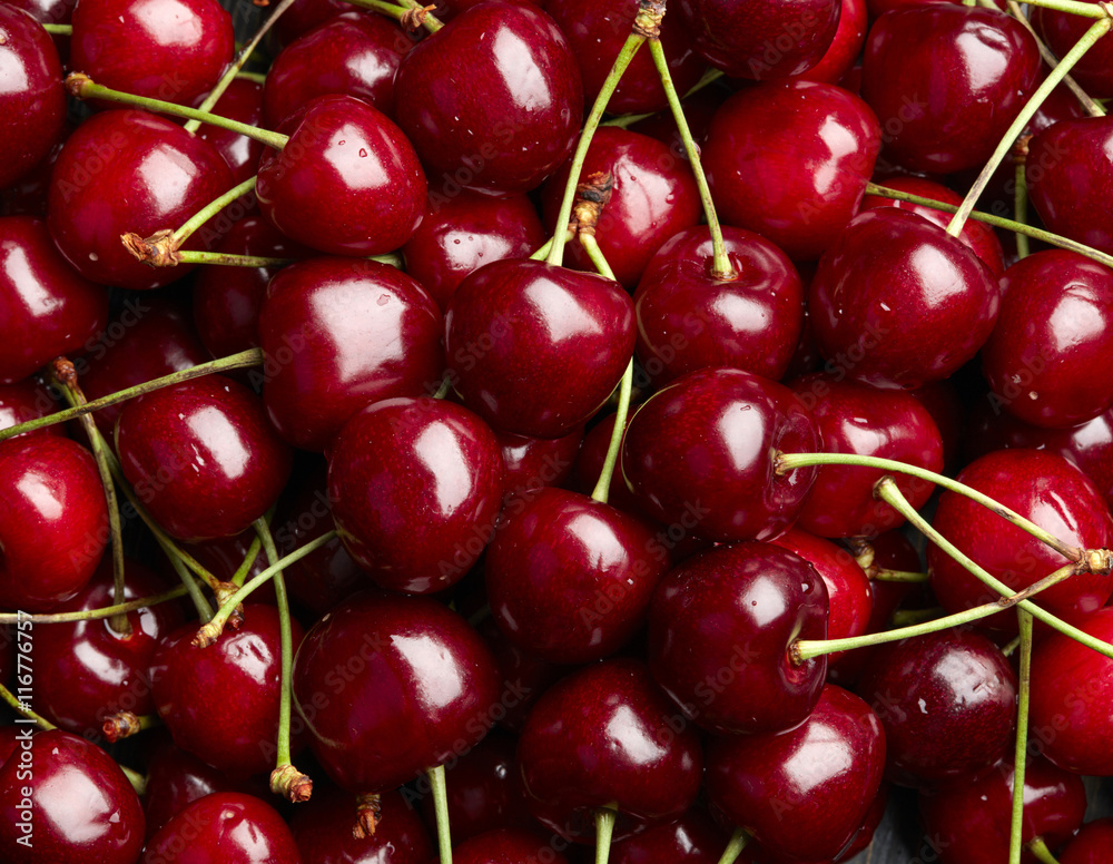 Cherry Background. Sweet organic cherries on market counter Cherry Background. Sweet organic cherries on market counter