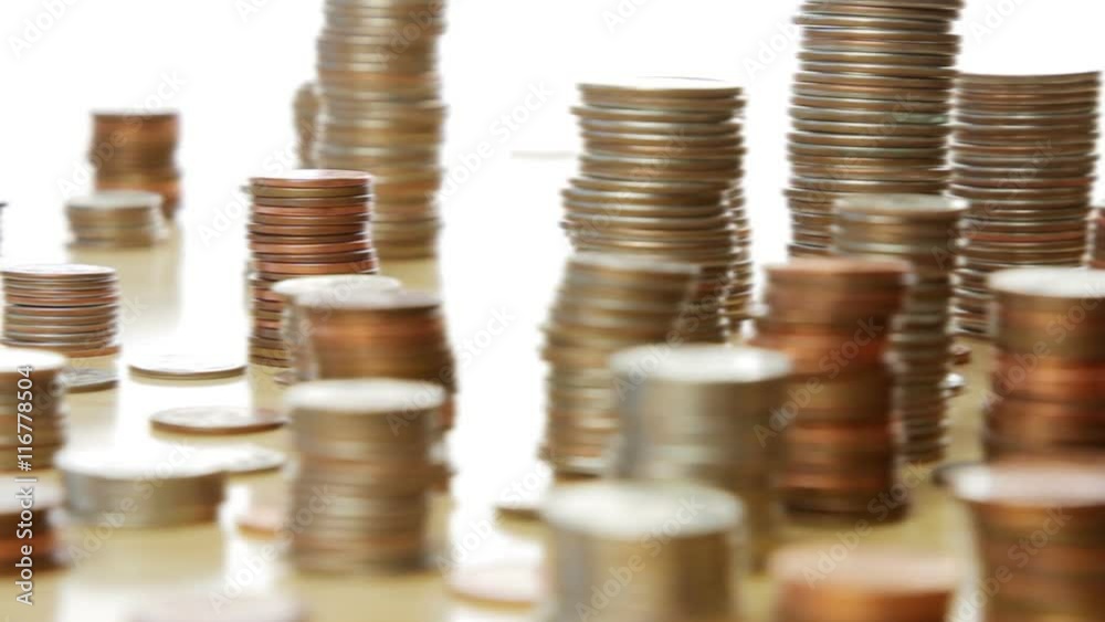 A city skyline made of stacked US coins. A city skyline made of stacked US coins.