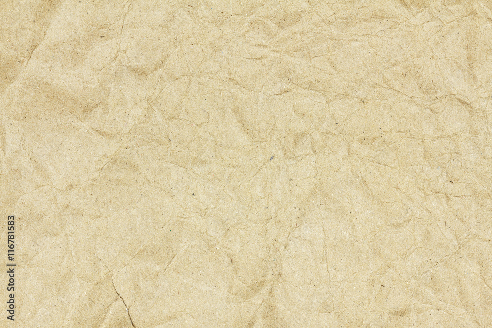 Naklejka premium Recycled crumpled brown paper texture or paper background for design with copy space for text or image.