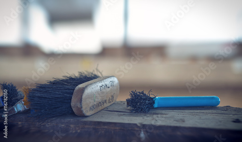 Two equestrian brushes on a wooden table