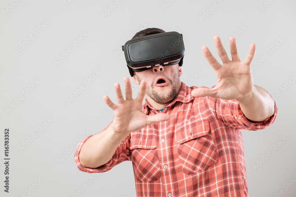 Man with virtual reality glasses showing gesture Man with virtual reality glasses showing gesture