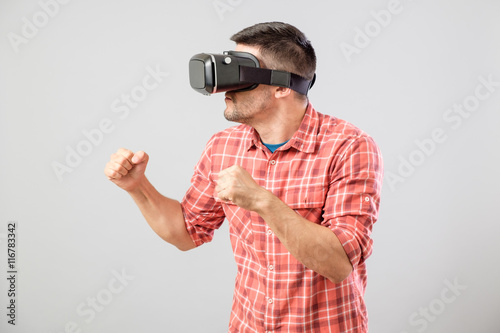 Man in fighter stand with virtual reality glasses