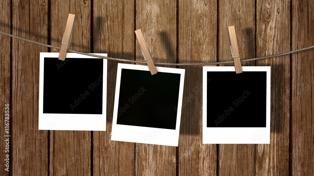three blank instant photos hanging on the clothesline three blank instant photos hanging on the clothesline