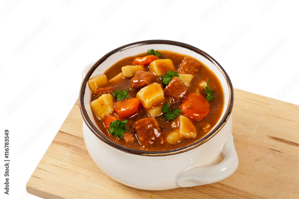 Slow Cooker Beef Stew Isolated on white. Selective focus. Slow Cooker Beef Stew Isolated on white. Selective focus.