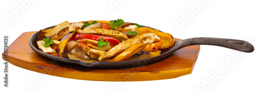 Chicken Fajitas Isolated over white background. Selective focus.