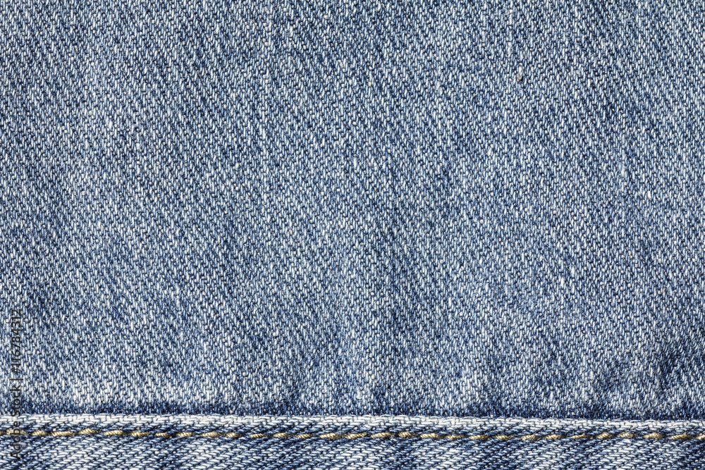 Denim jeans texture or denim jeans background with seam of fashion jeans design with copy space for text or image. Denim jeans texture or denim jeans background with seam of fashion jeans design with copy space for text or image.