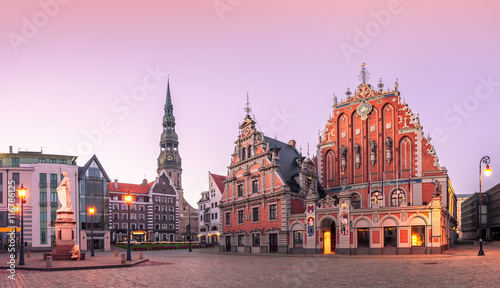 City Hall Square with House of the Blackheads and Saint Peter church in Riga Old Town During sunset time. photo